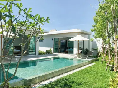 a villa with a swimming pool and a house at Shambhala grand villa by Cozy Lake in Bang Tao Beach