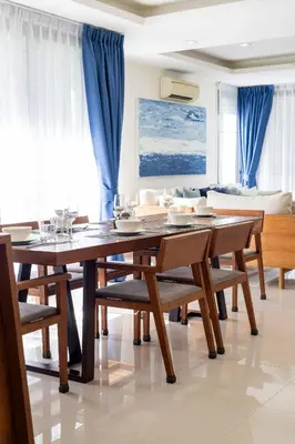 a dining room with a table and chairs at Hot! Laguna Park 5BR Modern Pool Villa - Bangtao Beach in Bang Tao Beach