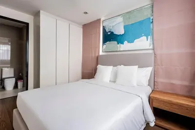 a white bed in a room with a large white bed sidx sidx sidx at Hot! Laguna Park 5BR Modern Pool Villa - Bangtao Beach in Bang Tao Beach