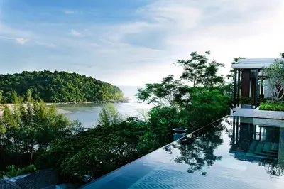 a swimming pool with a view of a river at Anantara Layan Phuket Resort in Layan Beach