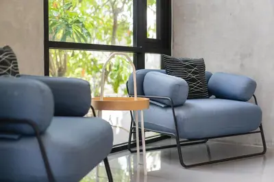 two blue chairs and a table in a room at Villa Lami - Luxury 3-Bedroom Modern Villa in Phuket with Private Pool, Gym & Sauna in Phuket Town