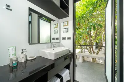 a bathroom with a sink and a mirror at Villa Lami - Luxury 3-Bedroom Modern Villa in Phuket with Private Pool, Gym & Sauna in Phuket Town