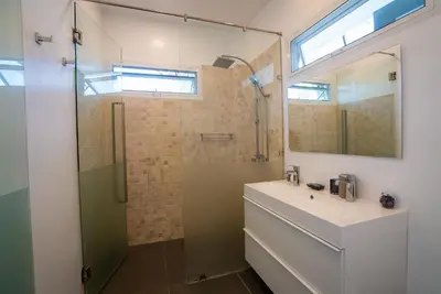 a bathroom with a sink and a shower and a mirror at Villa Ayan, Amazing Pool, 2 bedrooms Near Nai harn Beach in Rawai Beach
