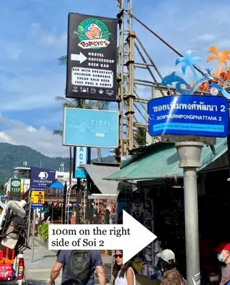 a sign that says room on the right side of sect at Popeyes Hostel Patong in Patong Beach