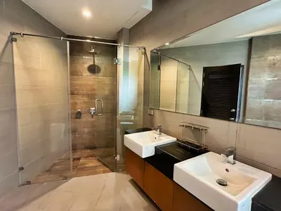 a bathroom with two sinks and a shower at Villa Tara nr Layan Beach in Bang Tao Beach