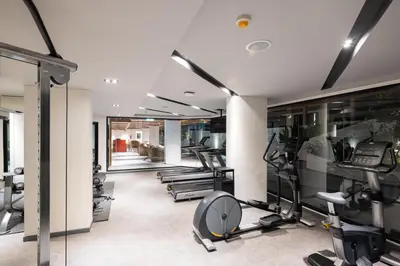 a gym with treadmills and elliptical machines at Travelodge Phuket Town in Phuket Town