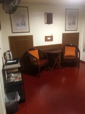 a living room with two chairs and a table at Phi Phi Dream Guest House in Phi Phi Don