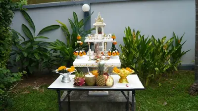 a table with a display of fruit on it at The Pace Phuket Boutique Resort in Rawai Beach