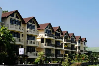a building with a lot of balconies on it at Sunset Apartment Phuket in Patong Beach