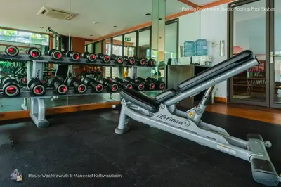 a rack of dumbbells in a gym at ✪✪✪✪✪ Patong Beachfront Studio Rooftop Pool Skybar in Patong Beach