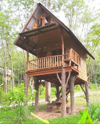 a tree house in the middle of the forest at Treehouse Holidays-Family house in Ko Yao Noi