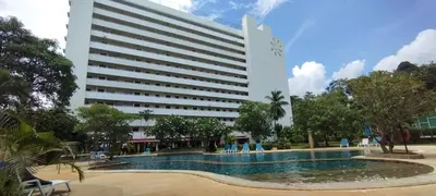 a hotel with a swimming pool in front of a building at Patong beach apartment for up to 4 person in Patong Beach