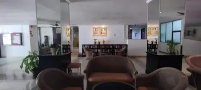 a lobby with chairs and tables in a building at Patong beach apartment for up to 4 person in Patong Beach