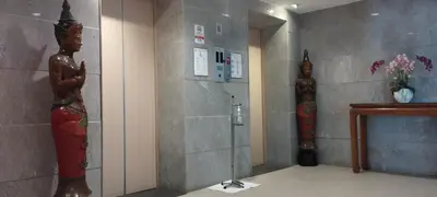 a room with statues and a fireplace in a building at Patong beach apartment for up to 4 person in Patong Beach