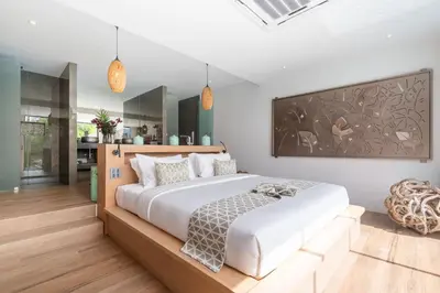 a bedroom with a large bed in a room at Blue Coral Luxury Villa - Tropical Modern Living in Phuket Town