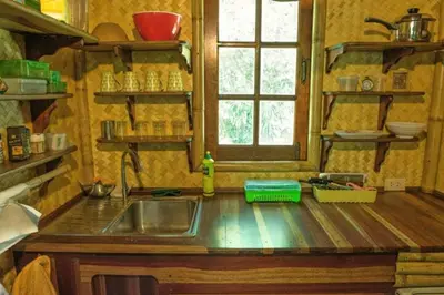 a kitchen counter with a sink and a window at Treehouse Holidays-Garden View in Ko Yao Noi