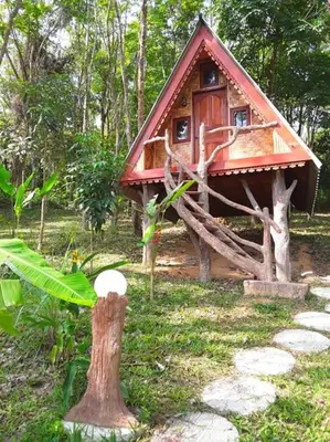 a small tree house in the middle of a forest at Treehouse Holidays-Little house in Ko Yao Noi