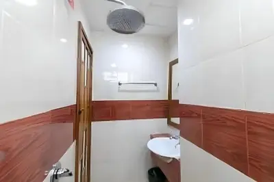 a bathroom with a sink and a toilet at Lotus Hotel Patong in Patong Beach
