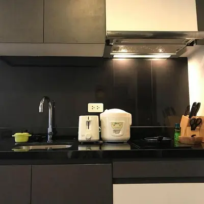 a kitchen with a sink and a counter top at The deck patong 5 Star Apartment \u5df4\u4e1cThe Deck\u65e0\u8fb9\u9645\u6d77\u666f\u6cf3\u6c60\u9152\u5e97 in Patong Beach