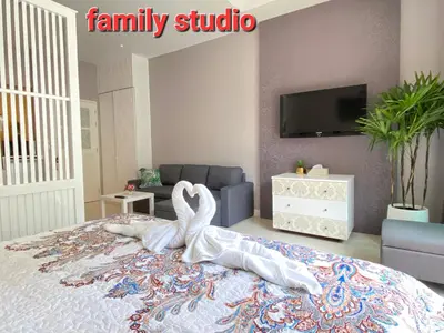 a bedroom with a bed with a swan on it at Thalassa Kata Beach in Kata Beach