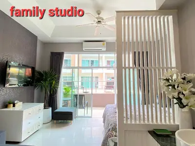 a living room with a sliding door to a living room at Thalassa Kata Beach in Kata Beach