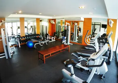 a gym with several treadmills and machines at CA Hotel and Residence Phuket - SHA Extra Plus in Phuket Town