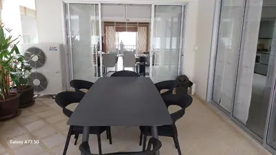 a conference room with a black table and chairs at Siam Palm Residence in Patong Beach