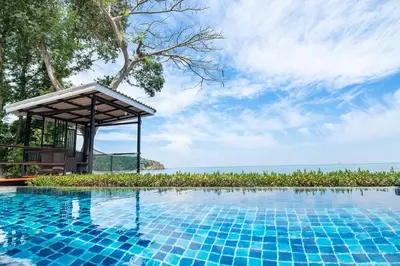 a swimming pool at a resort with a gazebo at Koh Sirey Beachfront Pool Villa - 2 Bedrooms House in Phuket Town