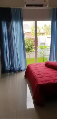 a bedroom with a red bed and a window at Новый дом 106 м2, территория 160 м2 и своя парковка in Phuket Town