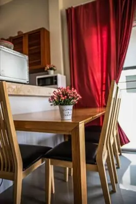 a wooden table with a potted plant on it in a kitchen at Новый дом 106 м2, территория 160 м2 и своя парковка in Phuket Town