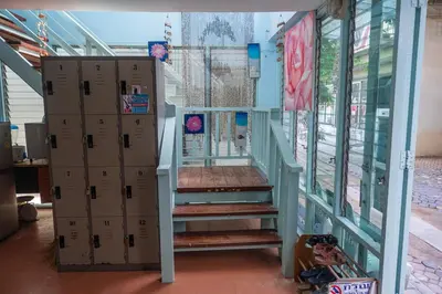 a staircase in a building with boxes next to it at Sea Shell Hut in Phi Phi Don