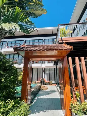 a wooden archway in front of a building at Z&Z House in Rawai Beach