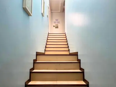a staircase in a building with wooden steps at Z&Z House in Rawai Beach
