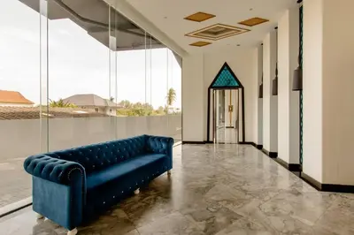 a blue couch in a hallway in a building at The Aristo 2 Condo Surin Beach in Surin Beach