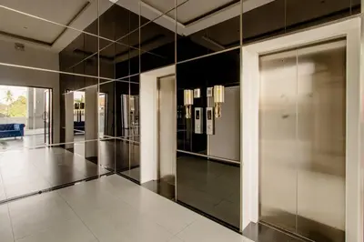 a hallway with a large mirror in a building at The Aristo 2 Condo Surin Beach in Surin Beach
