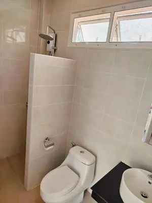 a bathroom with a toilet and a sink at The mantra resort in Ko Yao Yai