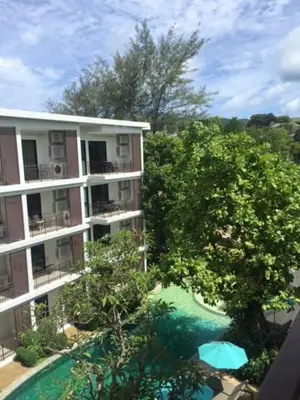 an aerial view of an apartment building with a swimming pool at The Title West Wing@Rawai By Siri in Rawai Beach