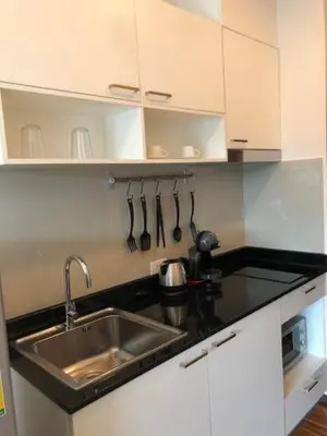 a kitchen with a sink and a counter top at The Title West Wing@Rawai By Siri in Rawai Beach