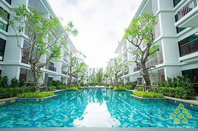 a swimming pool in the middle of a building at The Title West Wing@Rawai By Siri in Rawai Beach