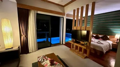 a large bedroom with a bed and a large window at Aonang Phu Dahla Private Pool & Sea View - SHA Plus in Ao Nang Beach