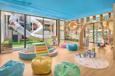 a childrens play area with a slide in a building at Hyatt Regency Phuket Resort in Kamala Beach
