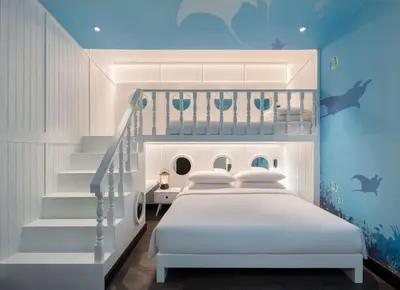 a bedroom with a white bed and a staircase at Hyatt Regency Phuket Resort in Kamala Beach