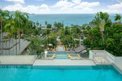 an aerial view of a swimming pool at a resort at Andamantra Resort and Villa Phuket in Patong Beach