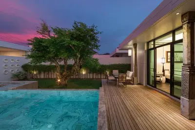 a house with a swimming pool in the backyard at MONO LUX Villa x MonthStayZ Thailand in Chalong