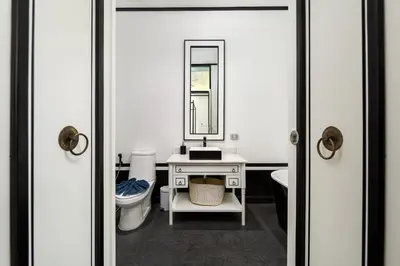a bathroom with a sink and a toilet and a mirror at MONO LUX Villa x MonthStayZ Thailand in Chalong