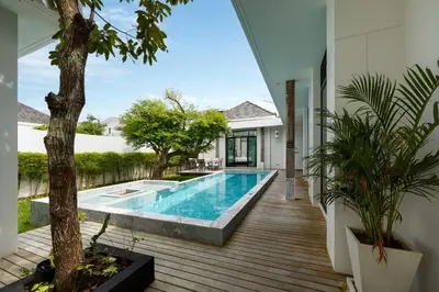 a swimming pool in the middle of a house at MONO LUX Villa x MonthStayZ Thailand in Chalong