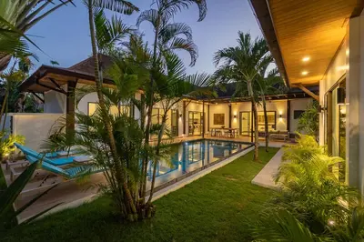 an exterior view of a villa with a swimming pool at villa Akala in Ban Saiyuan (1)