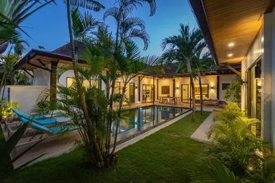 an exterior view of a villa with a swimming pool at villa Akala in Ban Saiyuan (1)