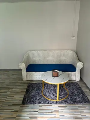 a living room with a couch and a coffee table at Lalisa Hotel Aonang in Ao Nang Beach