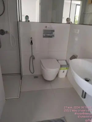 a bathroom with a shower and a toilet and a sink at Tao Resort and Villas (SHA Extra+) in Phuket Town